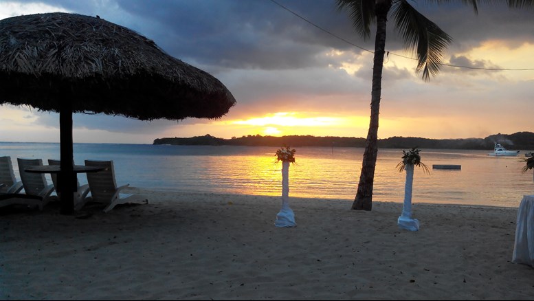 Beautiful sunset wedding on Fiji beach