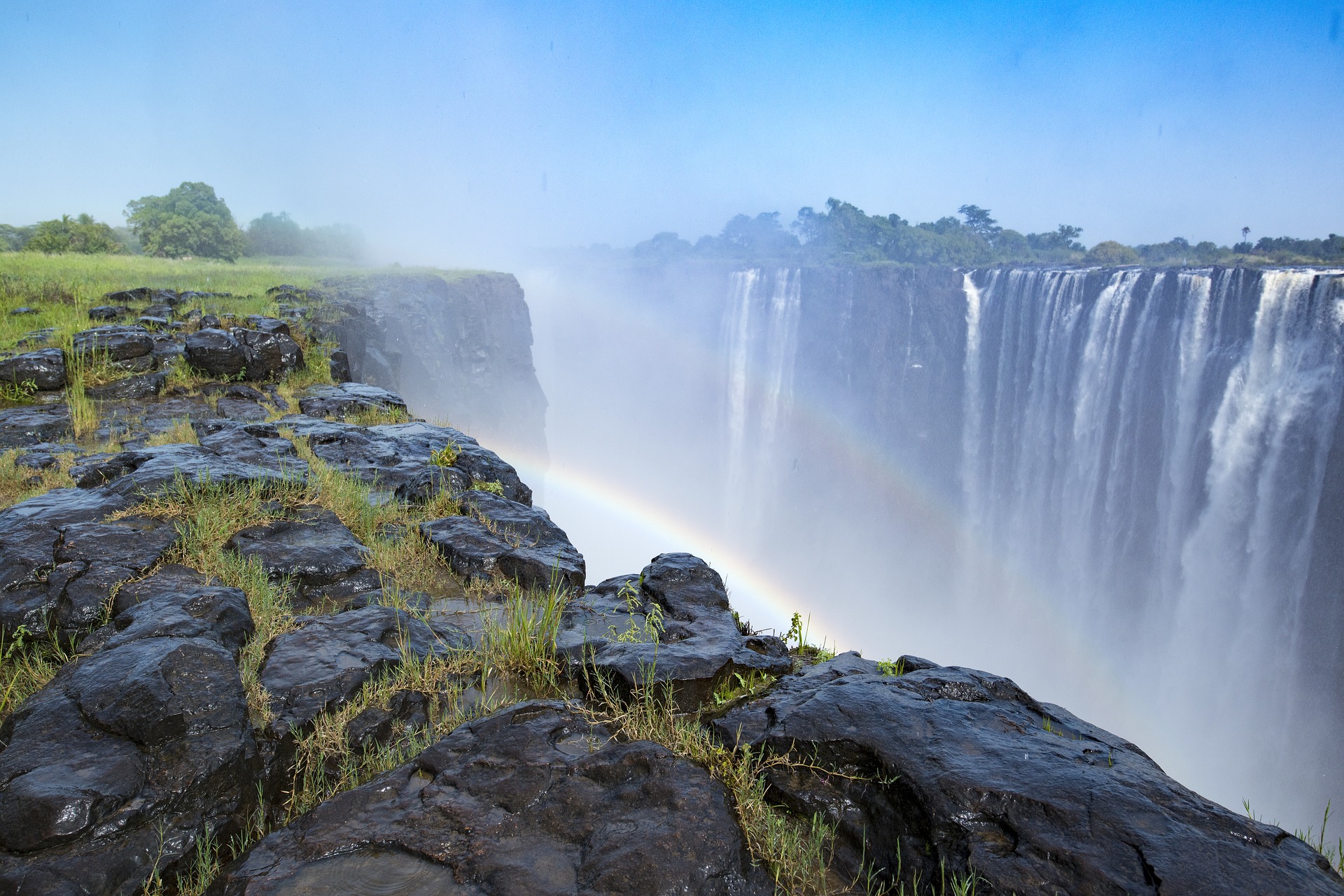 Rainbow over the amazing Victoria Falls in Zimbabwe