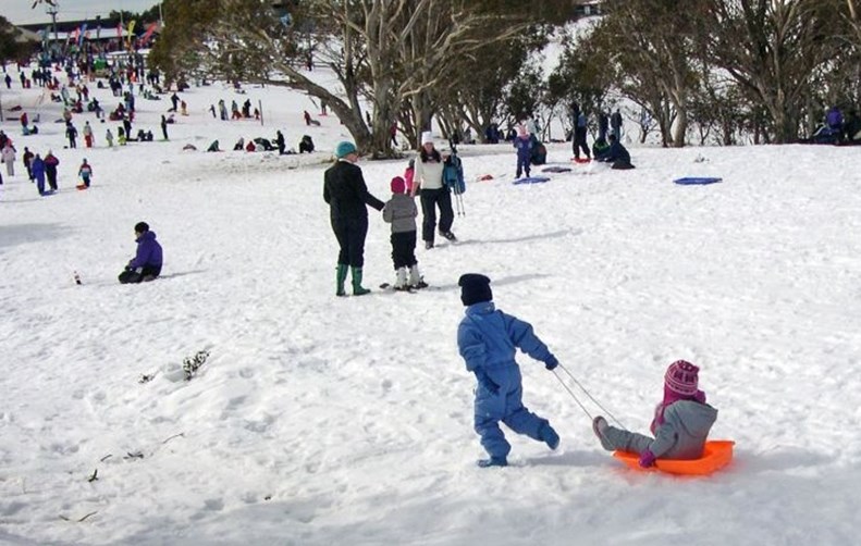 Children enjoying the toboggan field at Selwyn Snow Resort NSW