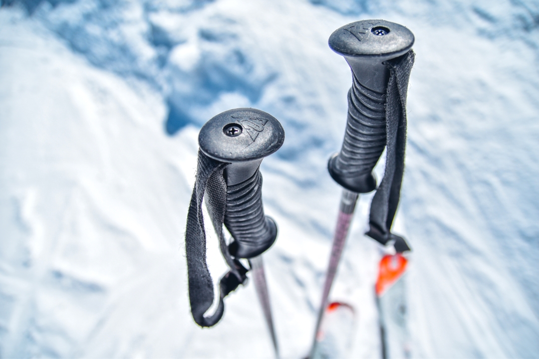 ski poles stuck in snow