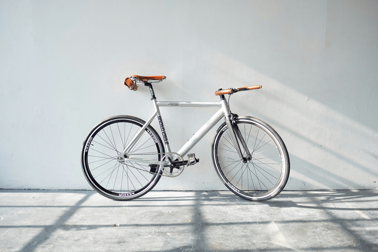 bicycle leaning against wall