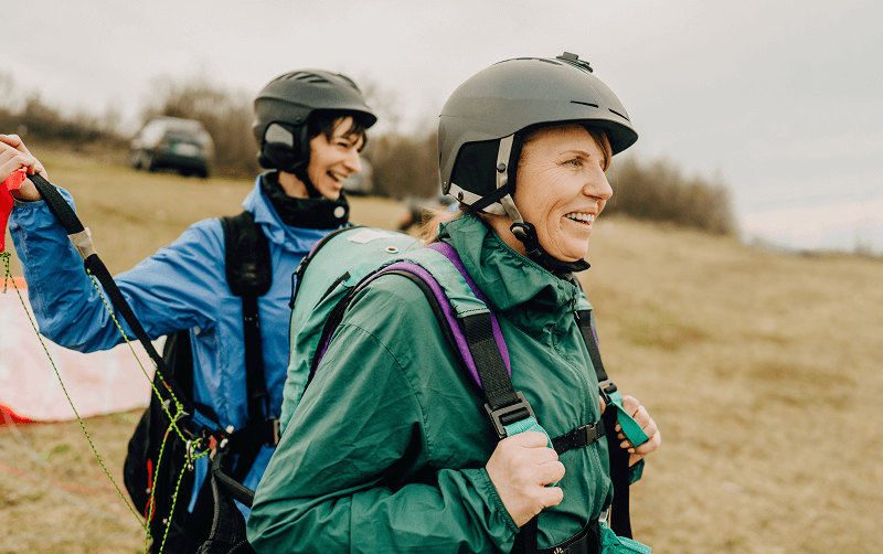 two women preparing for tandem skydiving
